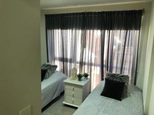 Ένα ή περισσότερα κρεβάτια σε δωμάτιο στο Umain