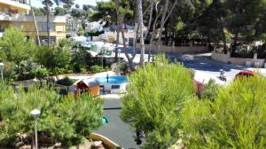 a view of a park with a playground and trees at Apartamento tosca mar con balcon 421 in Moraira