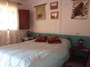 Postel nebo postele na pokoji v ubytování Hospedaje San Cayetano + 22 fotografií