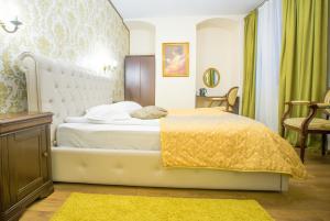 Postel nebo postele na pokoji v ubytování Safrano Palace