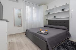 Posteľ alebo postele v izbe v ubytovaní Marea Apartments