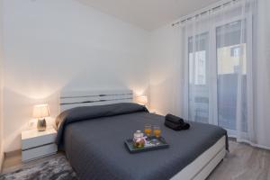 Posteľ alebo postele v izbe v ubytovaní Marea Apartments