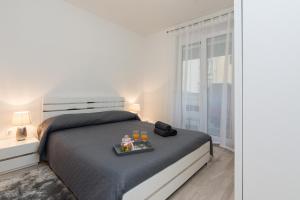 Posteľ alebo postele v izbe v ubytovaní Marea Apartments