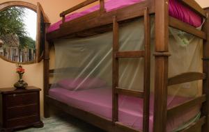 Palanda nebo palandy na pokoji v ubytování Hostal Corazón de Tagua