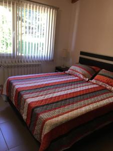 En eller flere senge i et værelse på Apartamento El Maiten