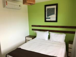 Кровать или кровати в номере Porto Praia do Forte
