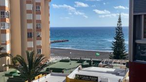 a view of the beach from a building at Apartamento Turistico Peñalver Playa 316 in Torrox Costa