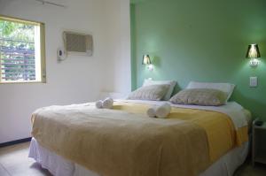 Posteľ alebo postele v izbe v ubytovaní Hotel La Gran Manzana