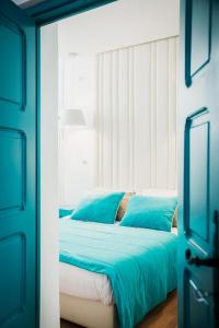 Säng eller sängar i ett rum på Les Jardins du Phare de Sidi Bou Said