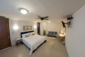 Postel nebo postele na pokoji v ubytování Hotel Siena + 37 fotografií