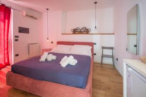 a bedroom with a bed and a dresser at Antichi Ricordi in Caltanissetta