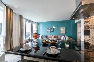 a living room with a table and a couch at The View Gammarth in Gammarth