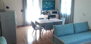 a living room with a table and a couch at Minies Beach Villas in Minia