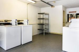 an empty room with white counters and a shelf at Studio 6 Extended Stay - Lagrange, GA in La Grange