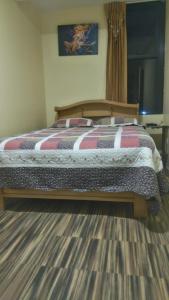 Postel nebo postele na pokoji v ubytování Hostal Inca