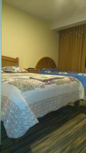 Postel nebo postele na pokoji v ubytování Hostal Inca