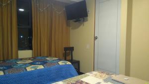 Postel nebo postele na pokoji v ubytování Hostal Inca