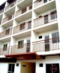 a white building with balconies on the side of it at Condo Transient Near NAIA Airport T1234 with Unlimited WIFI v1 in Manila