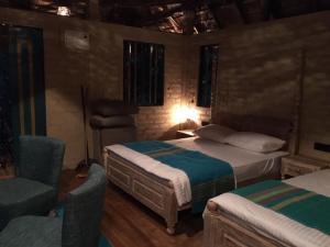 Tempat tidur dalam kamar di Rambas Reserve