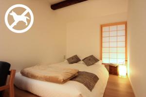 Postel nebo postele na pokoji v ubytování Auberge AZABU