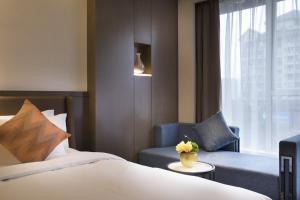 Postel nebo postele na pokoji v ubytování Paco Hotel Dongpu Guanghzou -Free Shuttle Bus for Canton Fair