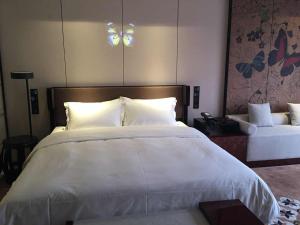 Postel nebo postele na pokoji v ubytování Paco Hotel Dongpu Guanghzou -Free Shuttle Bus for Canton Fair