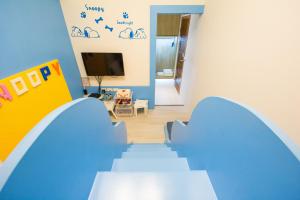 Een TV en/of entertainmentcenter bij Childlike B&B
