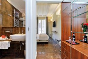 Letto o letti in una camera di Piazza Venezia Grand Suite