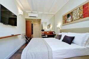 Letto o letti in una camera di Piazza Venezia Grand Suite
