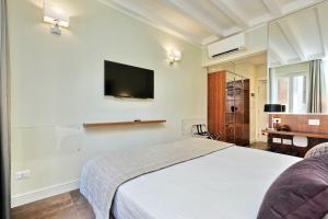 TV o dispositivi per l'intrattenimento presso Piazza Venezia Grand Suite