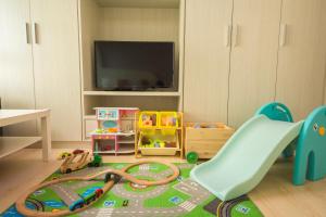 Een TV en/of entertainmentcenter bij Childlike B&B
