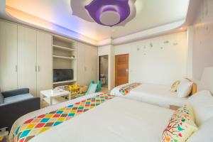 Een bed of bedden in een kamer bij Childlike B&B