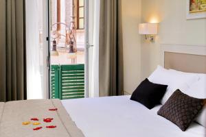 Letto o letti in una camera di Piazza Venezia Grand Suite