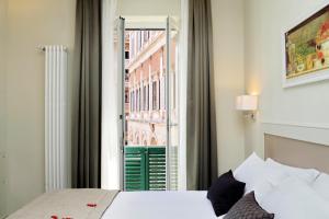 Letto o letti in una camera di Piazza Venezia Grand Suite