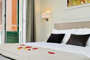 Letto o letti in una camera di Piazza Venezia Grand Suite