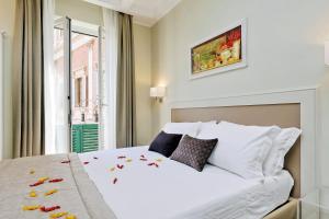 Letto o letti in una camera di Piazza Venezia Grand Suite