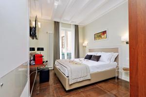 Letto o letti in una camera di Piazza Venezia Grand Suite