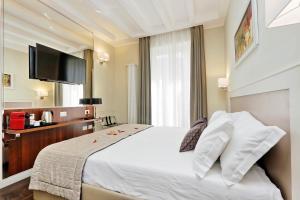 Letto o letti in una camera di Piazza Venezia Grand Suite