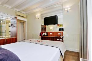 TV o dispositivi per l'intrattenimento presso Piazza Venezia Grand Suite