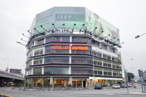 a building with a sign on the top of it at LEO Express Hotel in Kuala Lumpur
