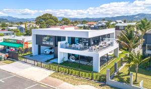 an aerial view of a white house at Waters Edge B&B in Whitianga