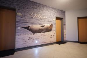 a sign for a store with a polar bear on the wall at Ferienwohnungen Auf der Düne in Cuxhaven