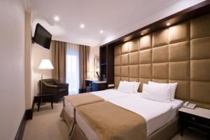 Postel nebo postele na pokoji v ubytování Rixos-Prykarpattya Resort