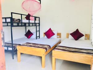 Postel nebo postele na pokoji v ubytování Aa Inn