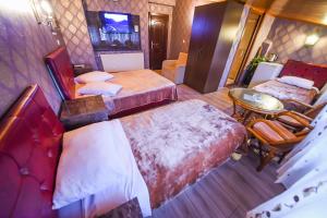 Postel nebo postele na pokoji v ubytování Kosk Hotel Kadikoy