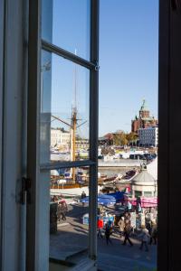 an open window with a view of a harbor at Hotel Haven in Helsinki