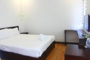Postel nebo postele na pokoji v ubytování Hoang Y Homestay