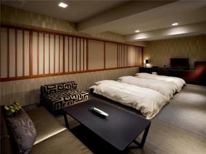 Postelja oz. postelje v sobi nastanitve Village Kyoto