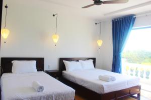 Postel nebo postele na pokoji v ubytování Hoang Y Homestay