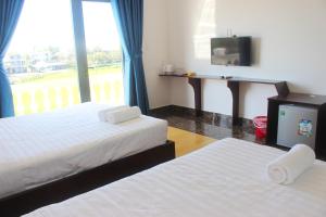 Postel nebo postele na pokoji v ubytování Hoang Y Homestay
